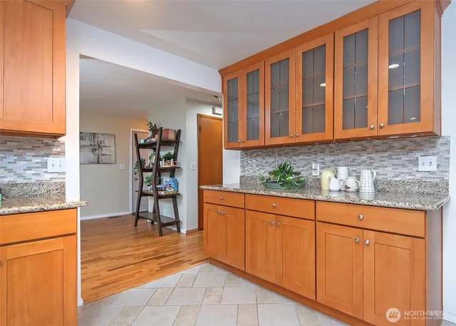 a view of kitchen with furniture and cabinets