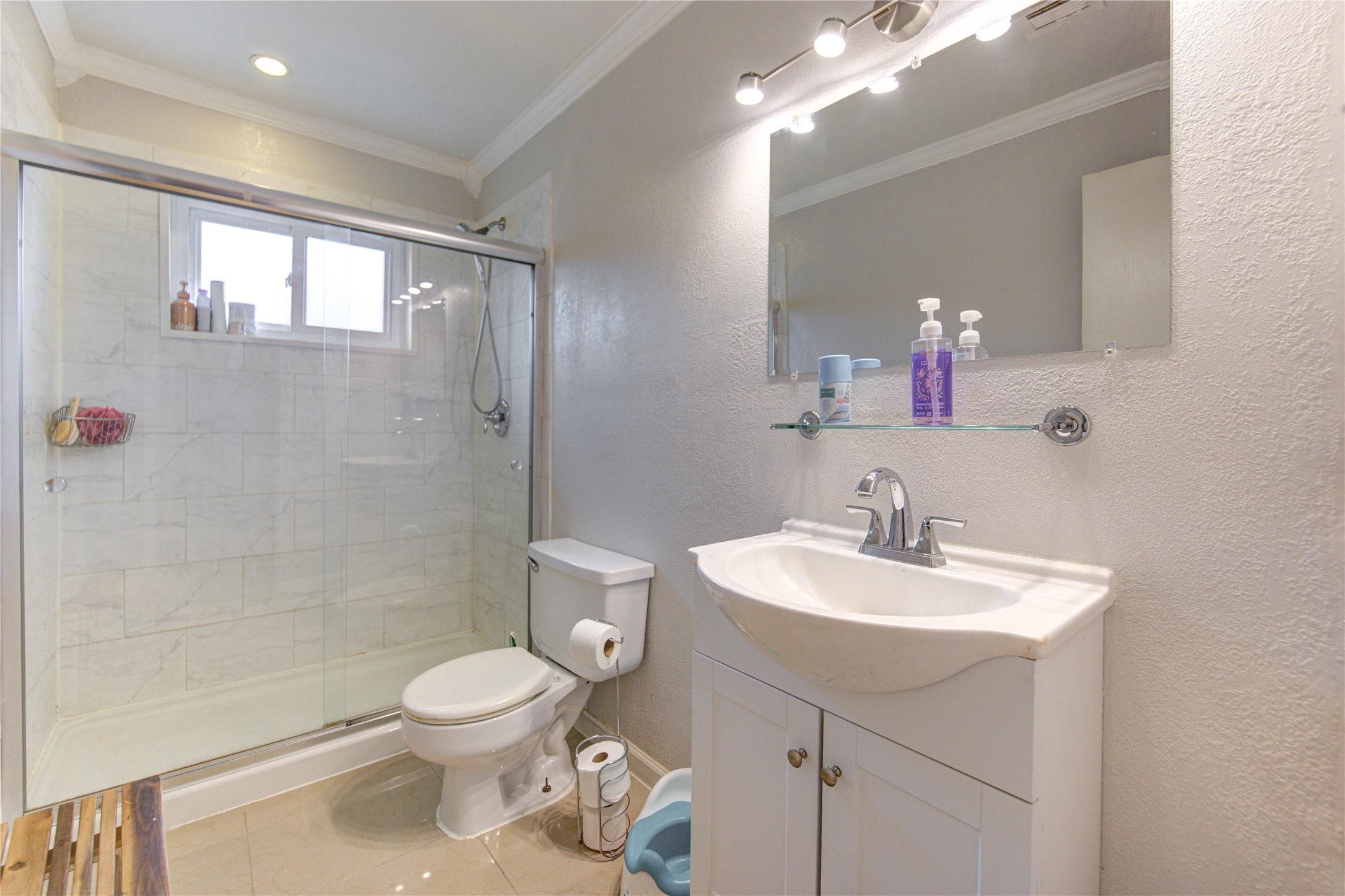1403 Packsaddle Lane Baytown, TX 77521 - Photo 12 of 19 a bathroom with a sink toilet a mirror and shower