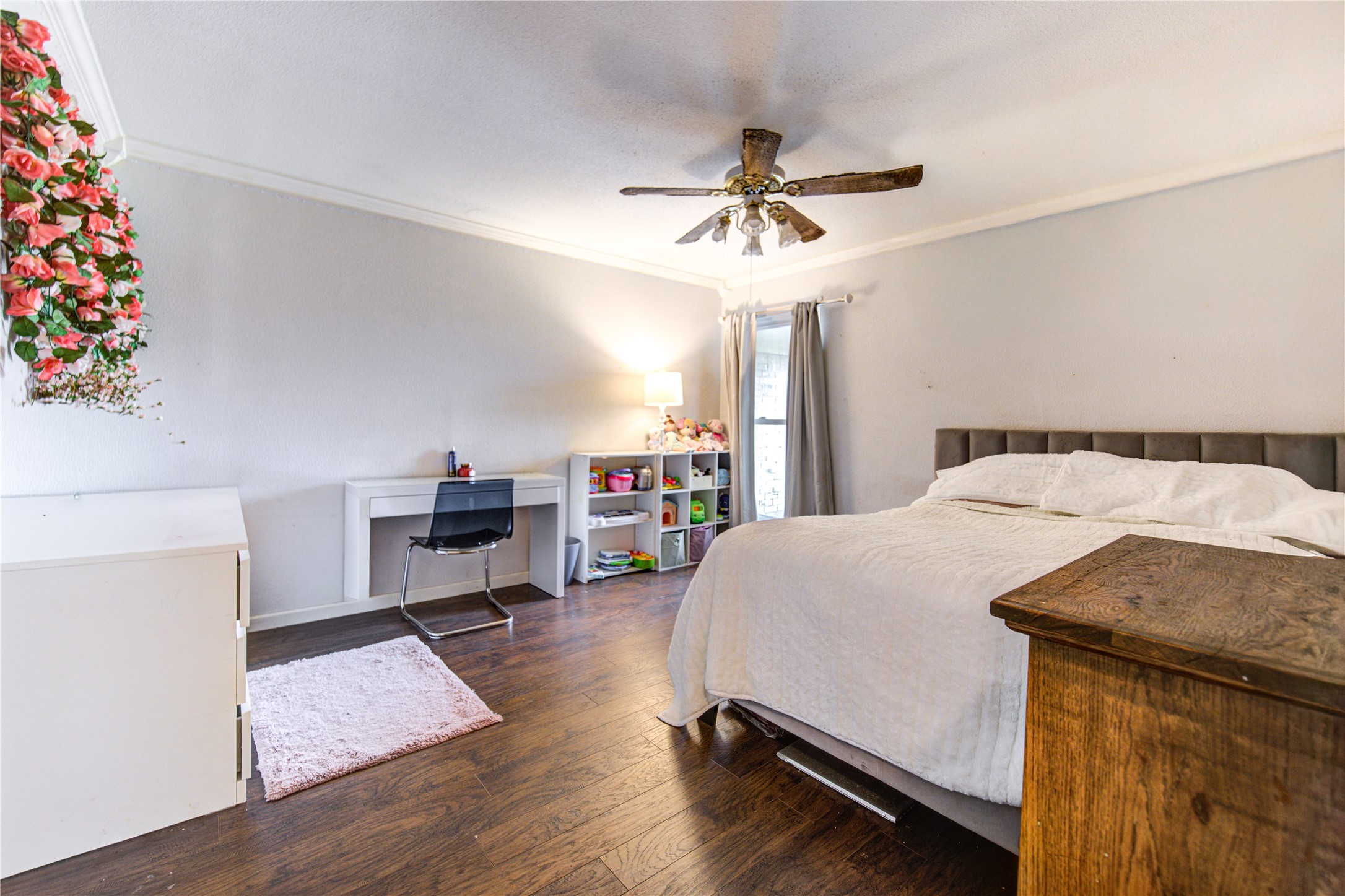 1403 Packsaddle Lane Baytown, TX 77521 - Photo 13 of 19 a bed room with a bed and a chandelier