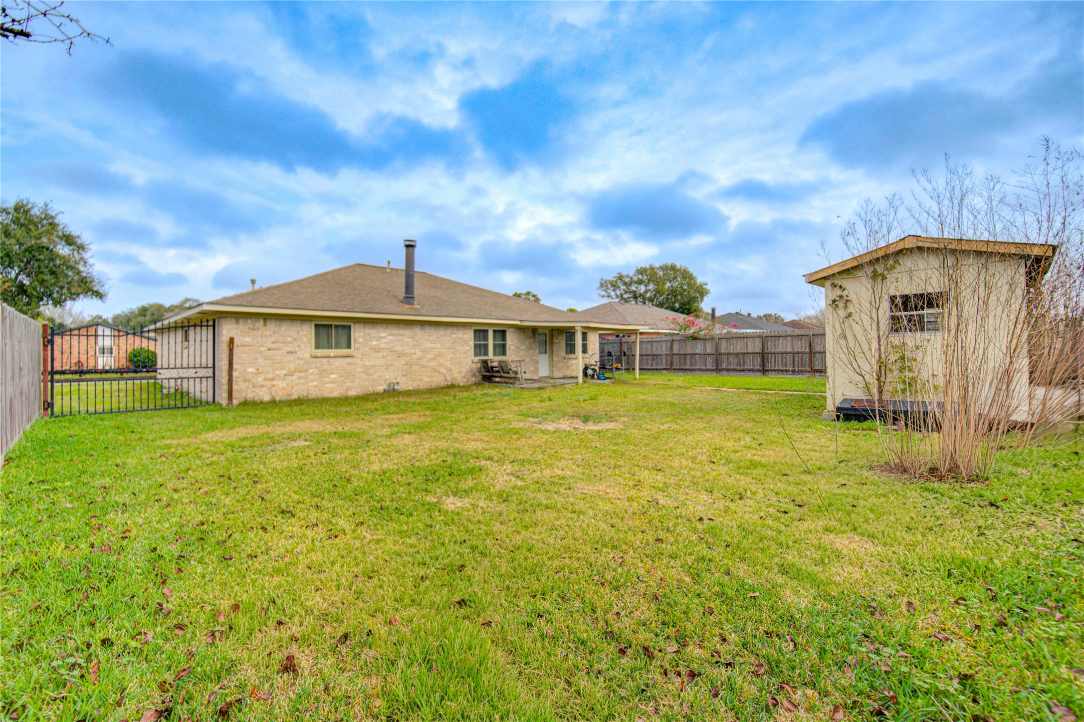 1403 Packsaddle Lane Baytown, TX 77521 - Photo 18 of 19 a front view of a house with garden