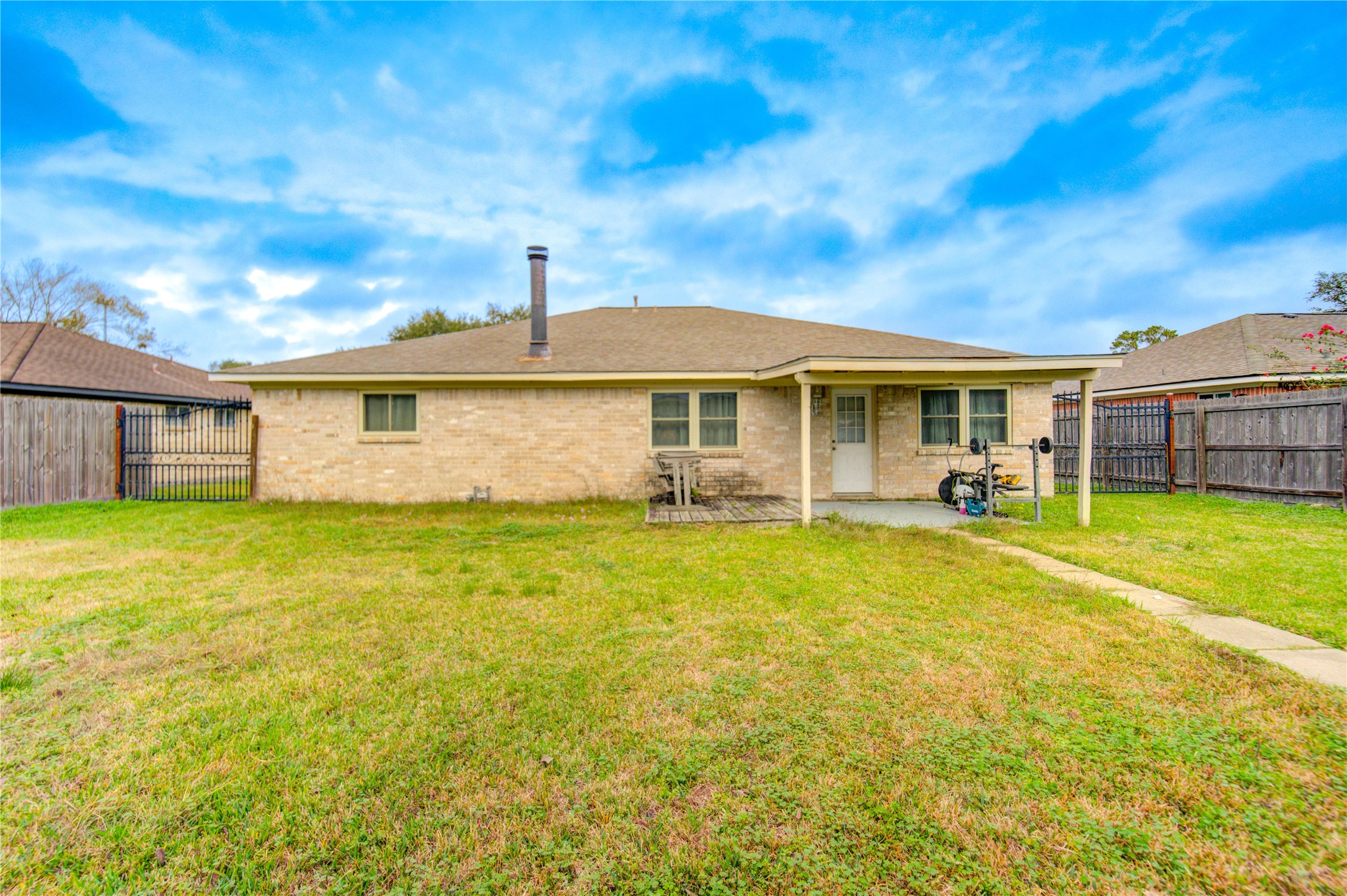 1403 Packsaddle Lane Baytown, TX 77521 - Photo 19 of 19 a front view of a house with a yard table and chairs