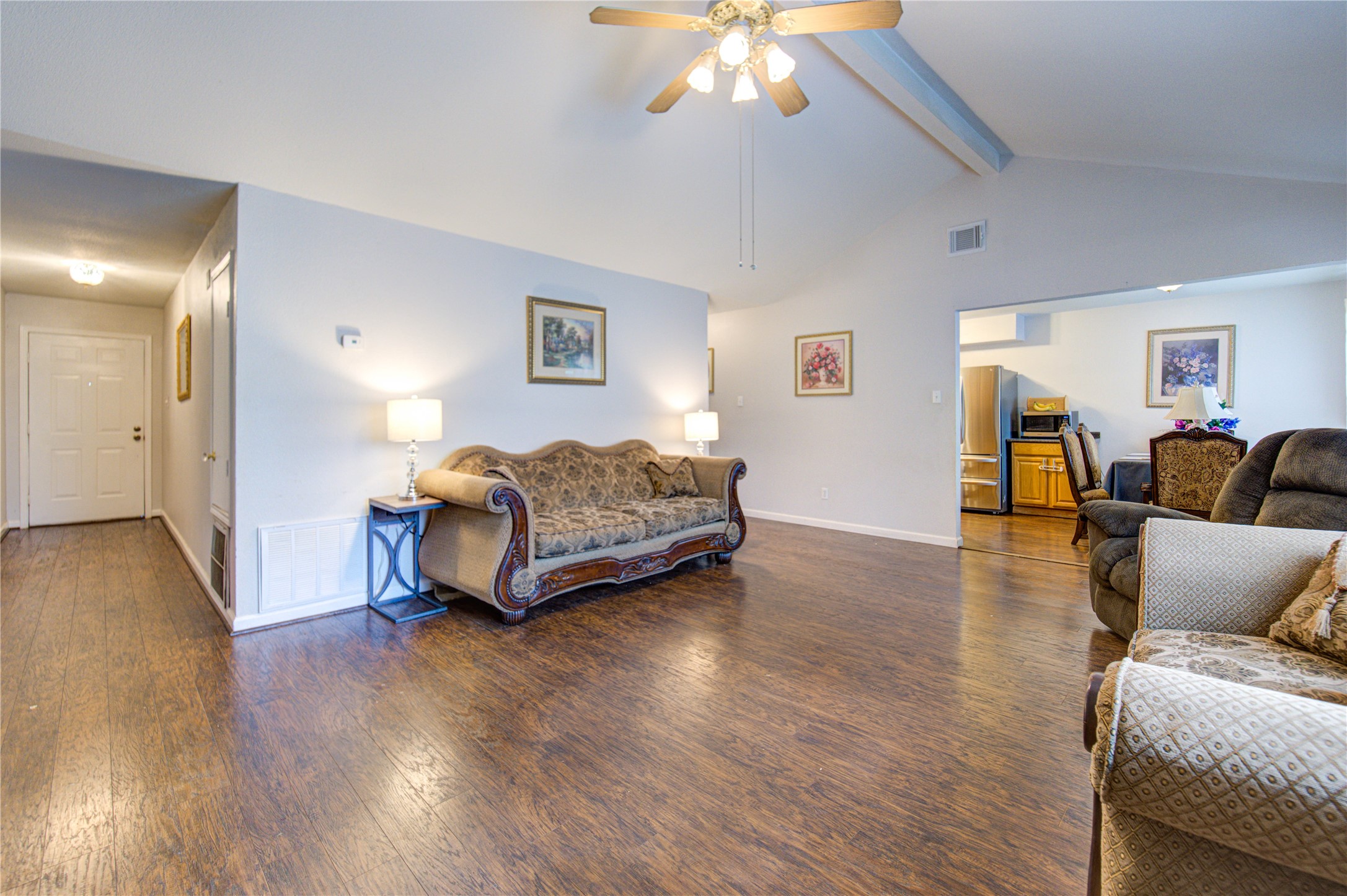 1403 Packsaddle Lane Baytown, TX 77521 - Photo 2 of 19 a living room with furniture and a chandelier