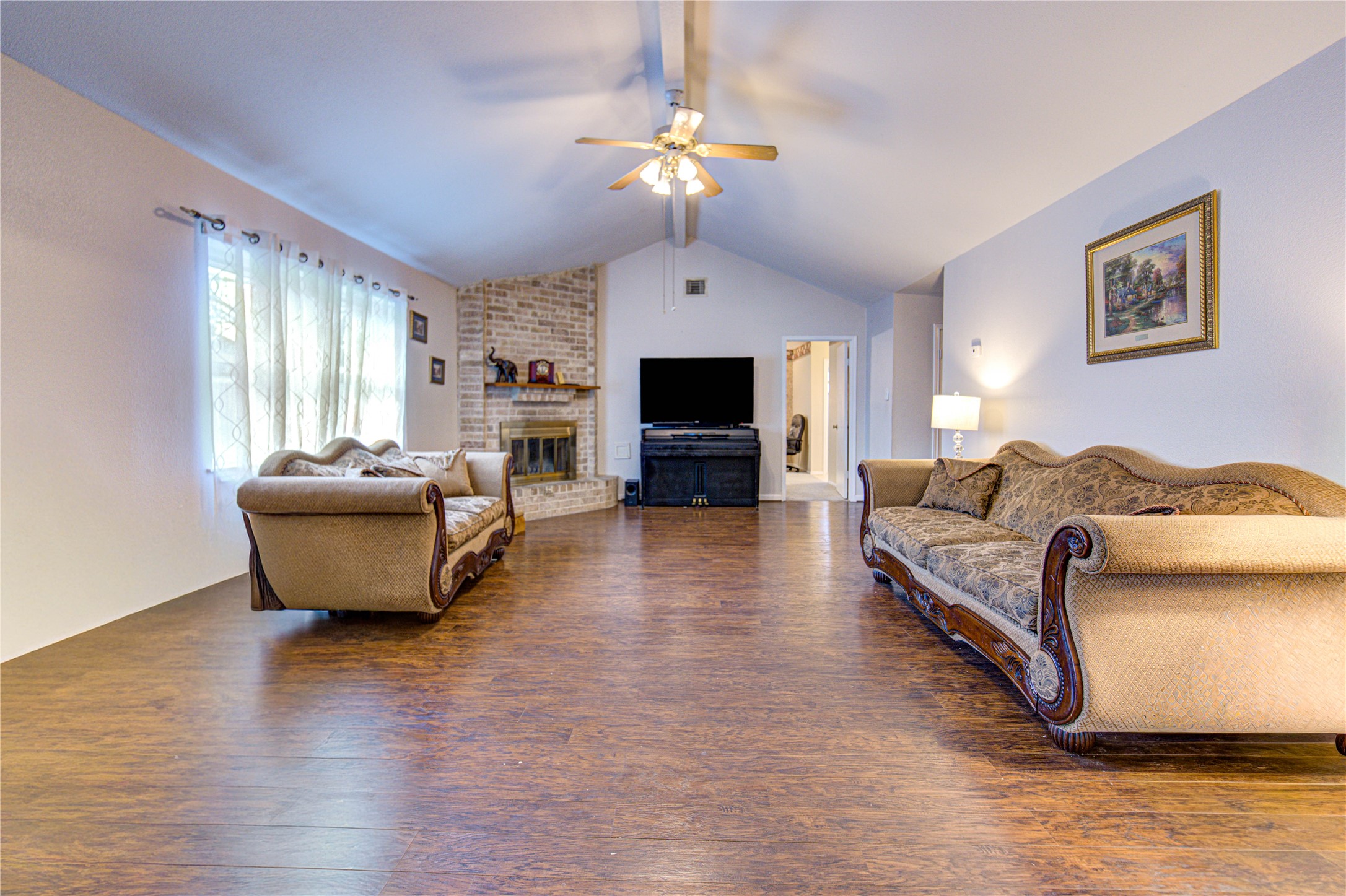 1403 Packsaddle Lane Baytown, TX 77521 - Photo 3 of 19 a living room with furniture and a flat screen tv