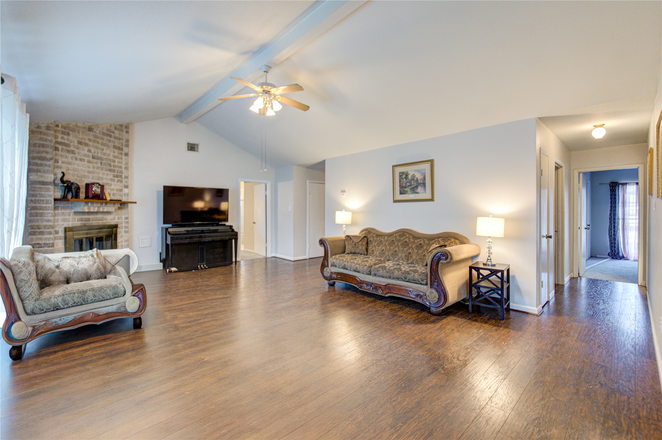 1403 Packsaddle Lane Baytown, TX 77521 - Photo 4 of 19 a living room with furniture and a flat screen tv