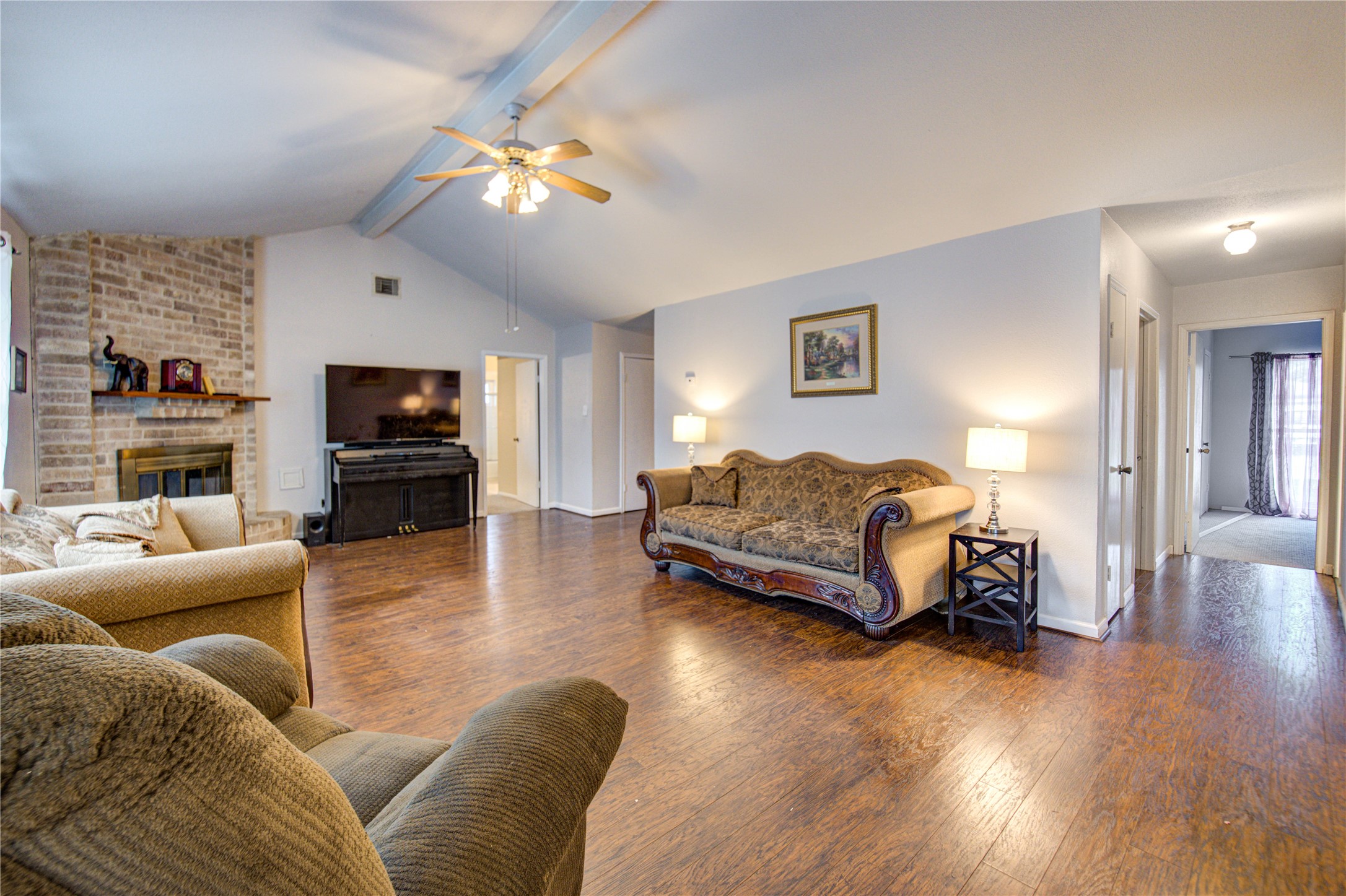 1403 Packsaddle Lane Baytown, TX 77521 - Photo 5 of 19 a living room with furniture and a flat screen tv