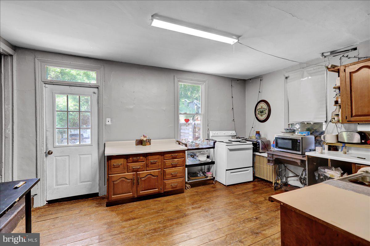 1634 Moselem Spring Road Hamburg, PA 19526 - Photo 16 of 21 a view of a kitchen with cabinets and wooden floor