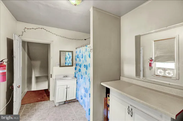 a view of a livingroom with lounge chair and painted walls