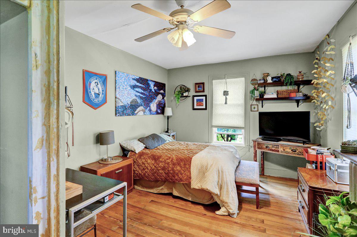 1634 Moselem Spring Road Hamburg, PA 19526 - Photo 18 of 21 a bedroom with a bed and a flat screen tv