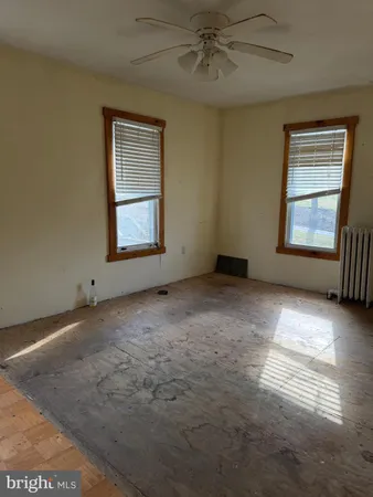 a view of an empty room and a window