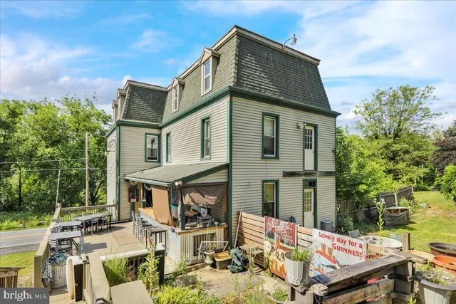 a view of a patio with table and chairs and potted plants