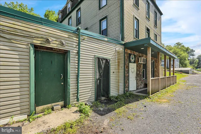 a view of a brick building with many windows