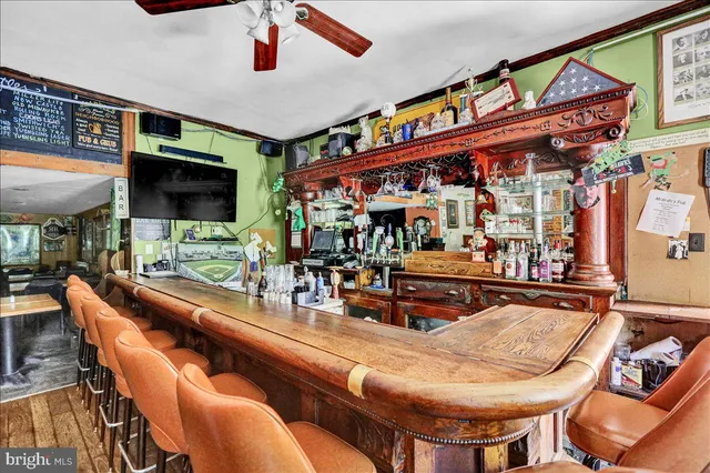 a outdoor living space with furniture and a flat screen tv