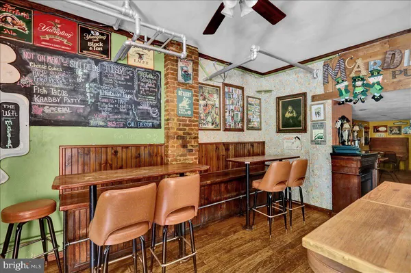 a view of a dining area with furniture and chandelier