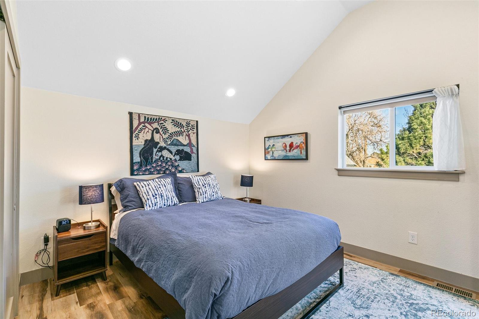 3885 Wolff Street Denver, CO 80212 - Photo 38 of 50 a bedroom with a bed and a painting on the wall