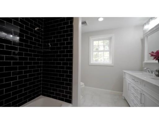 95 Old Mill Road Harvard, MA 01451 - Photo 19 of 42 a bathroom with a sink a toilet a mirror and shower