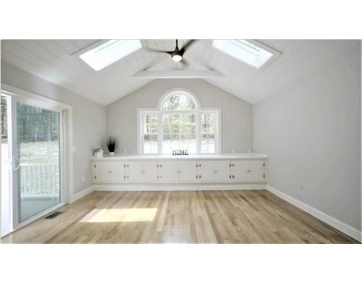 95 Old Mill Road Harvard, MA 01451 - Photo 2 of 42 a living room with a bed furniture and a large window