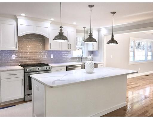 95 Old Mill Road Harvard, MA 01451 - Photo 3 of 42 a kitchen with stainless steel appliances granite countertop a sink a stove a chimney a sink and a wooden floor