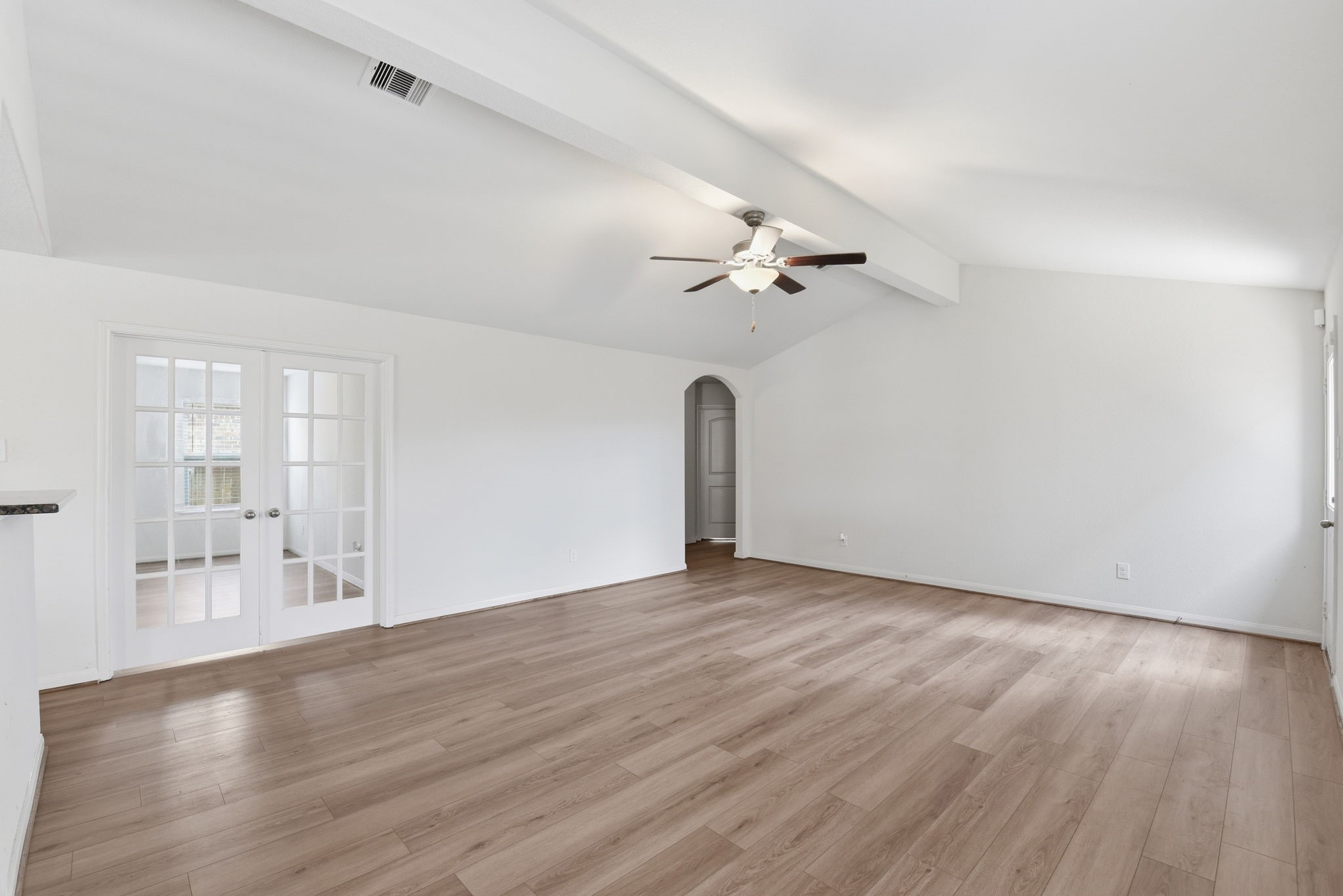 10802 Spring Brook Pass Drive Humble, TX 77396 - Photo 4 of 22 High ceilings and light and bright living room.
