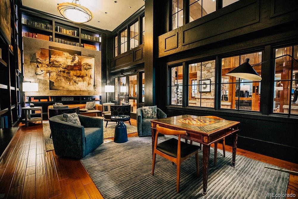 16 Vail Road, Unit 401 Vail, CO 81657 - Photo 13 of 35 a view of a dining room with furniture window and wooden floor