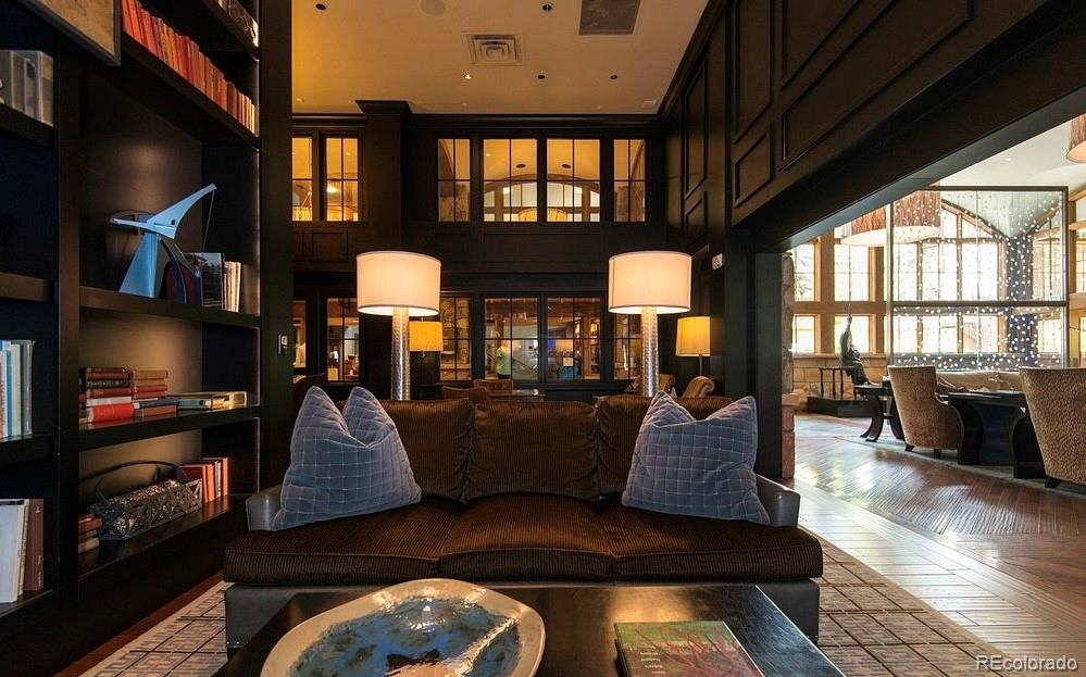 16 Vail Road, Unit 401 Vail, CO 81657 - Photo 14 of 35 a living room with furniture fireplace and a large window