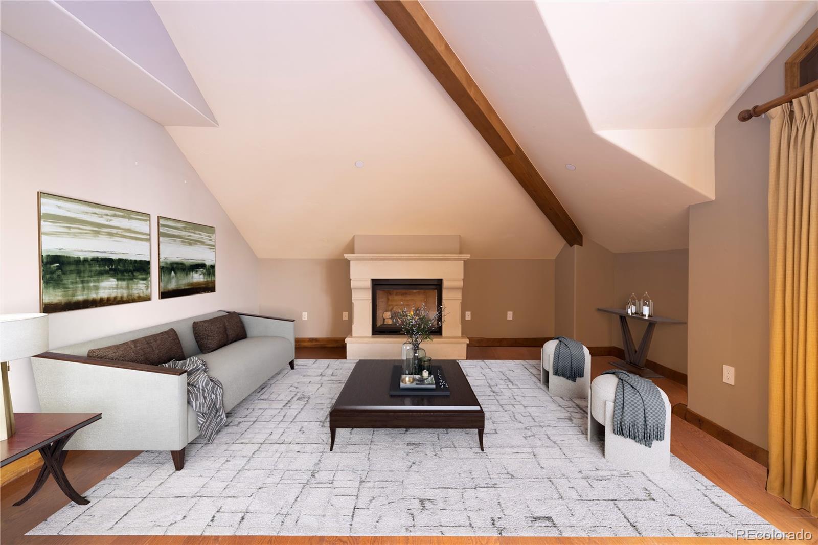 16 Vail Road, Unit 401 Vail, CO 81657 - Photo 15 of 35 a living room with furniture and a fireplace