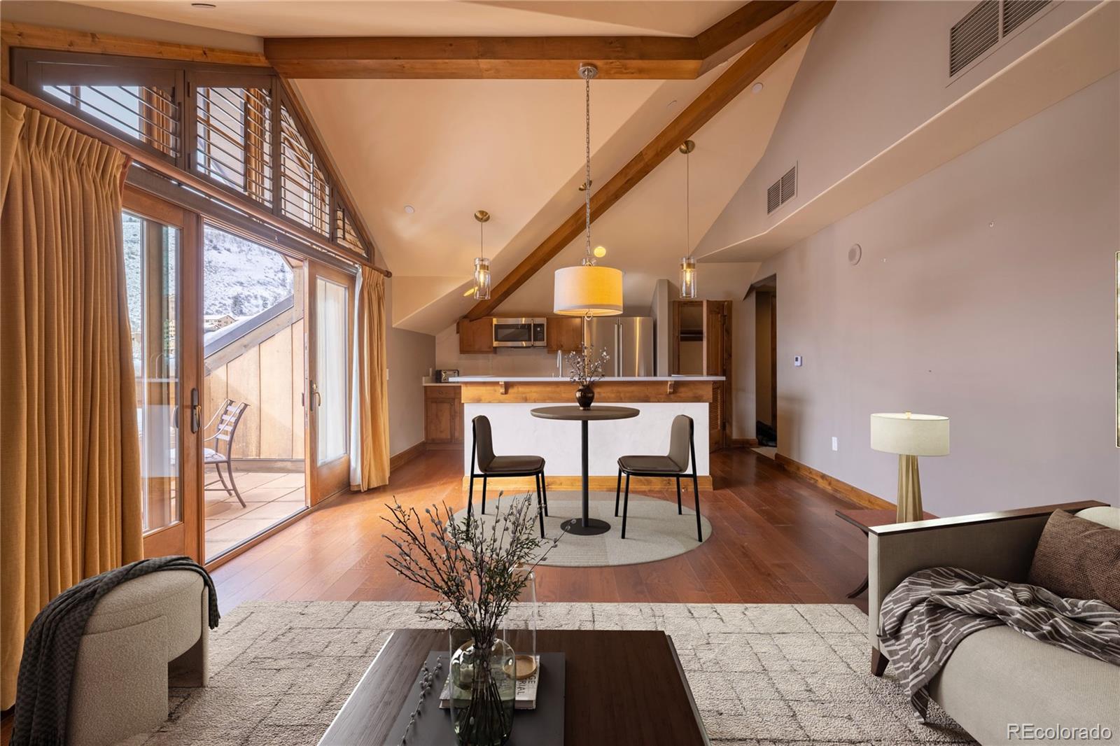16 Vail Road, Unit 401 Vail, CO 81657 - Photo 16 of 35 a living room with furniture and a large window