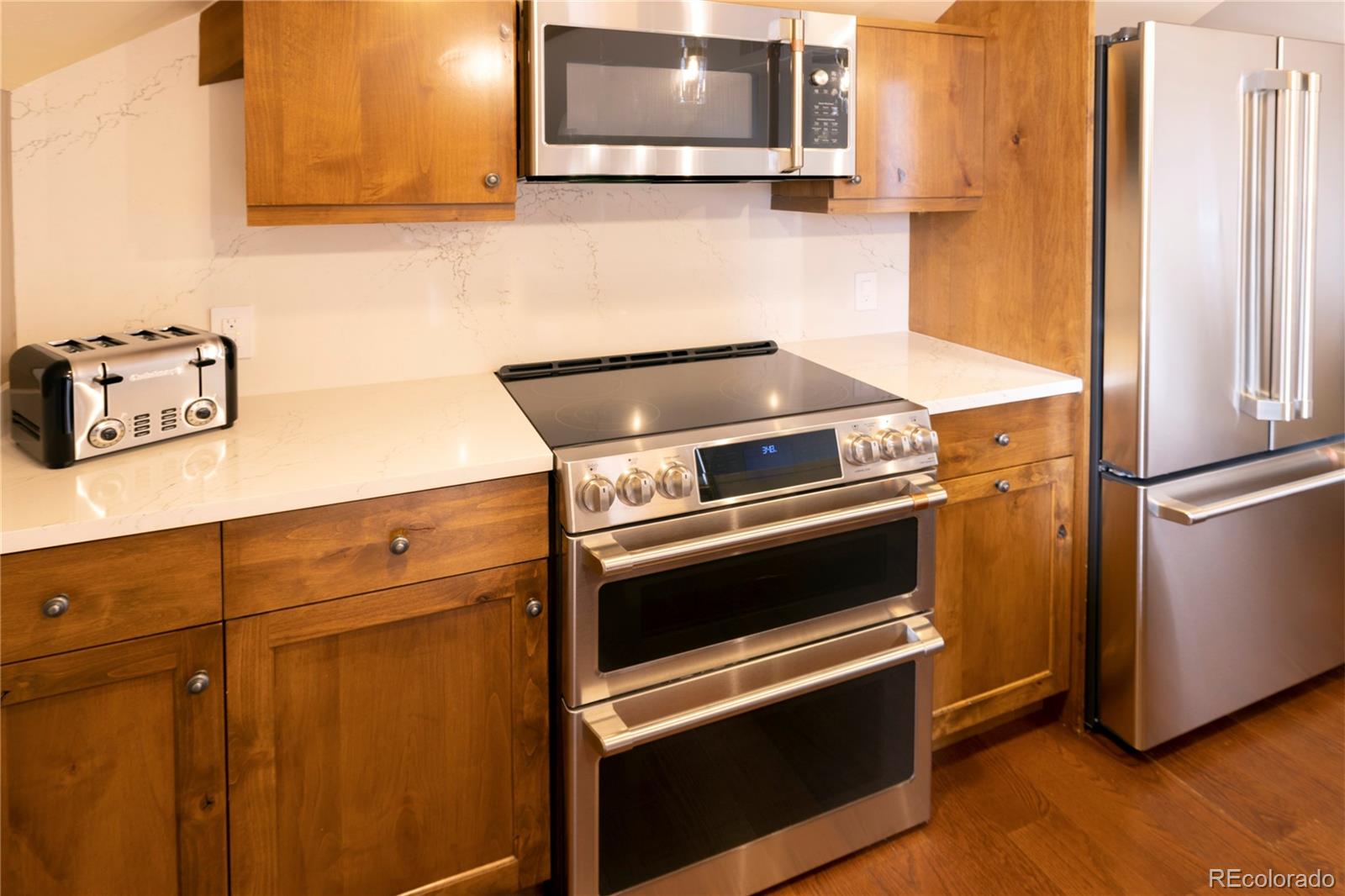 16 Vail Road, Unit 401 Vail, CO 81657 - Photo 19 of 35 a kitchen with appliances and cabinets