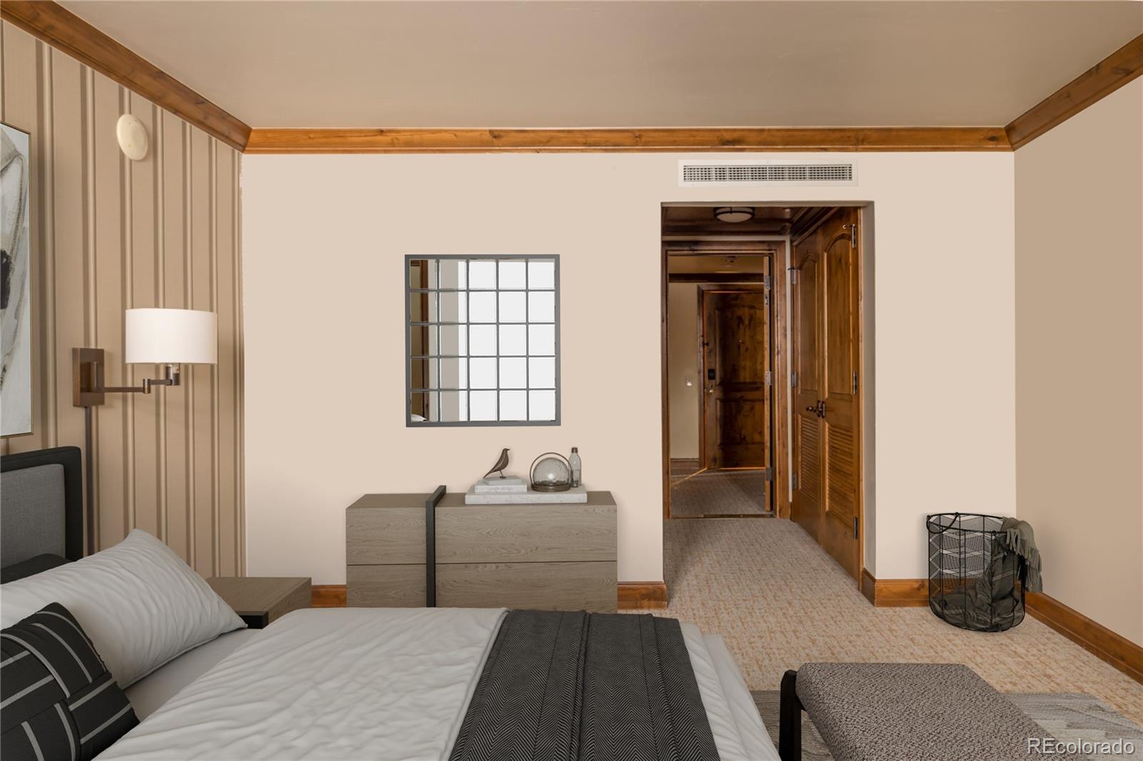 16 Vail Road, Unit 401 Vail, CO 81657 - Photo 21 of 35 a bedroom with a bed and wooden floor