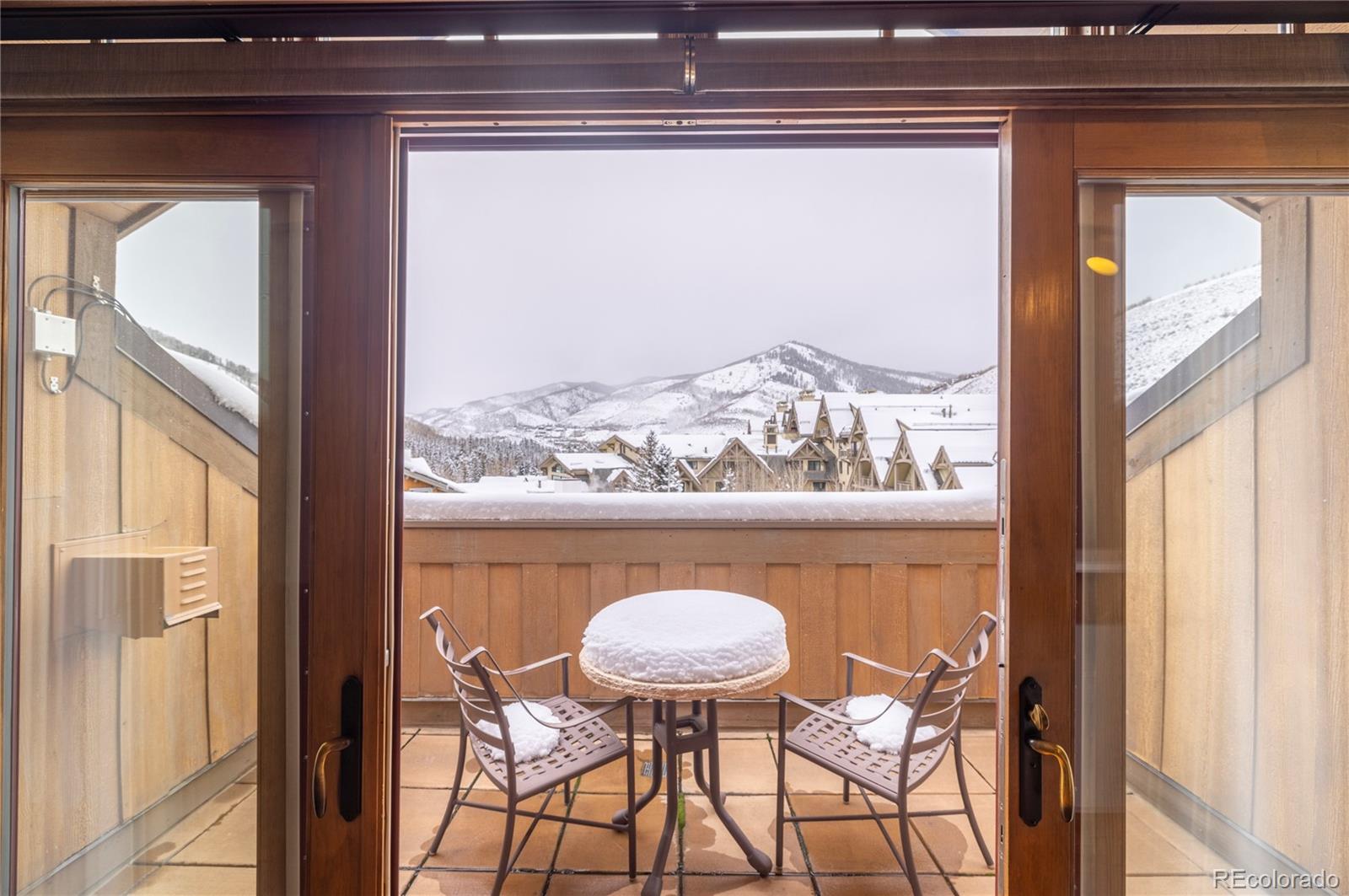 16 Vail Road, Unit 401 Vail, CO 81657 - Photo 24 of 35 a view of a dining room with furniture and a window