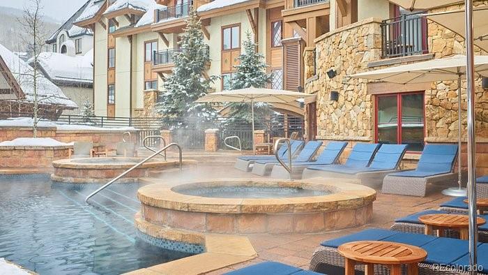 16 Vail Road, Unit 401 Vail, CO 81657 - Photo 4 of 35 a view of a very nice looking living room with a large window