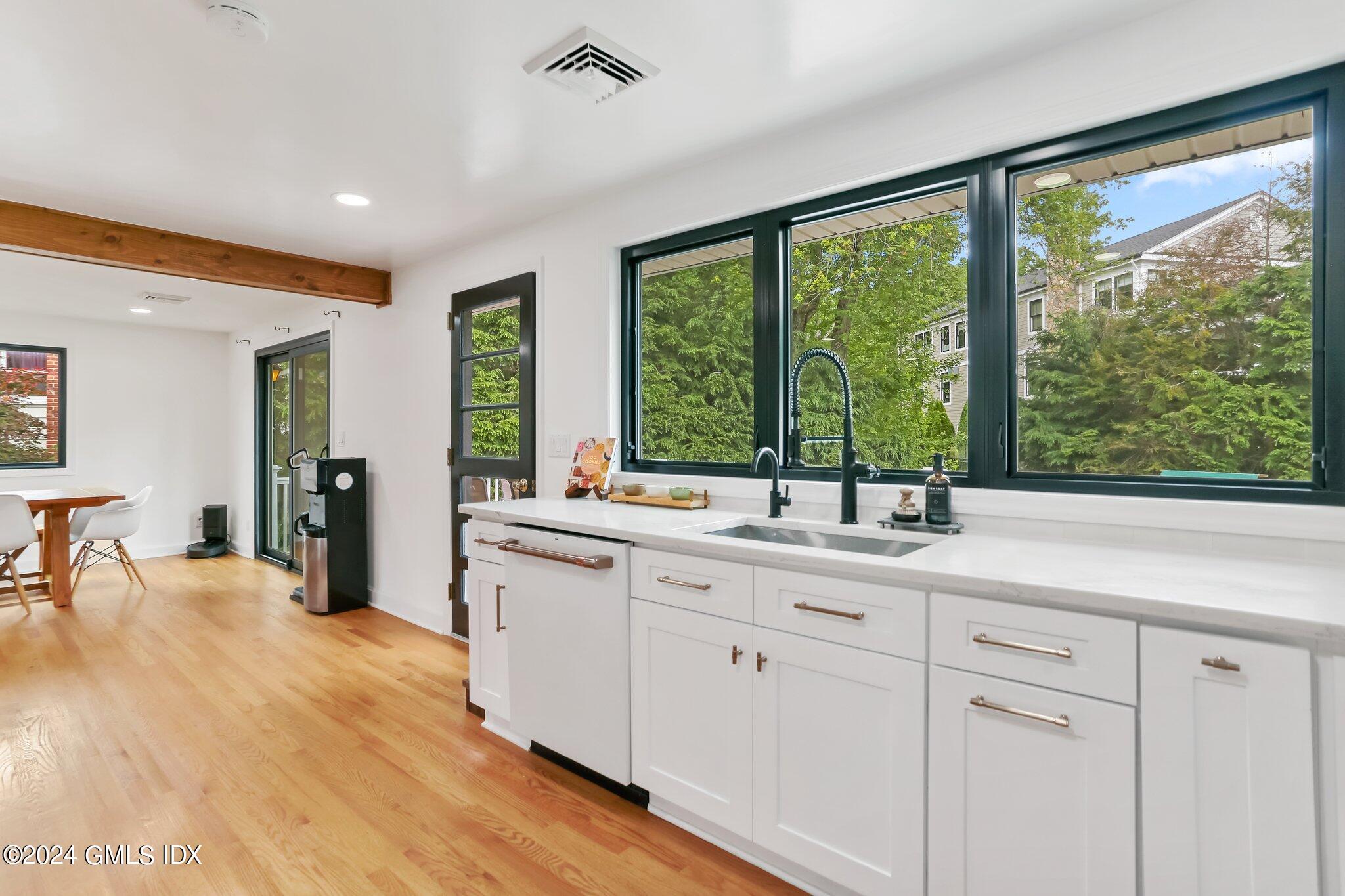 565 River Road Cos Cob, CT 06870 - Photo 11 of 29 a kitchen with a sink and large window