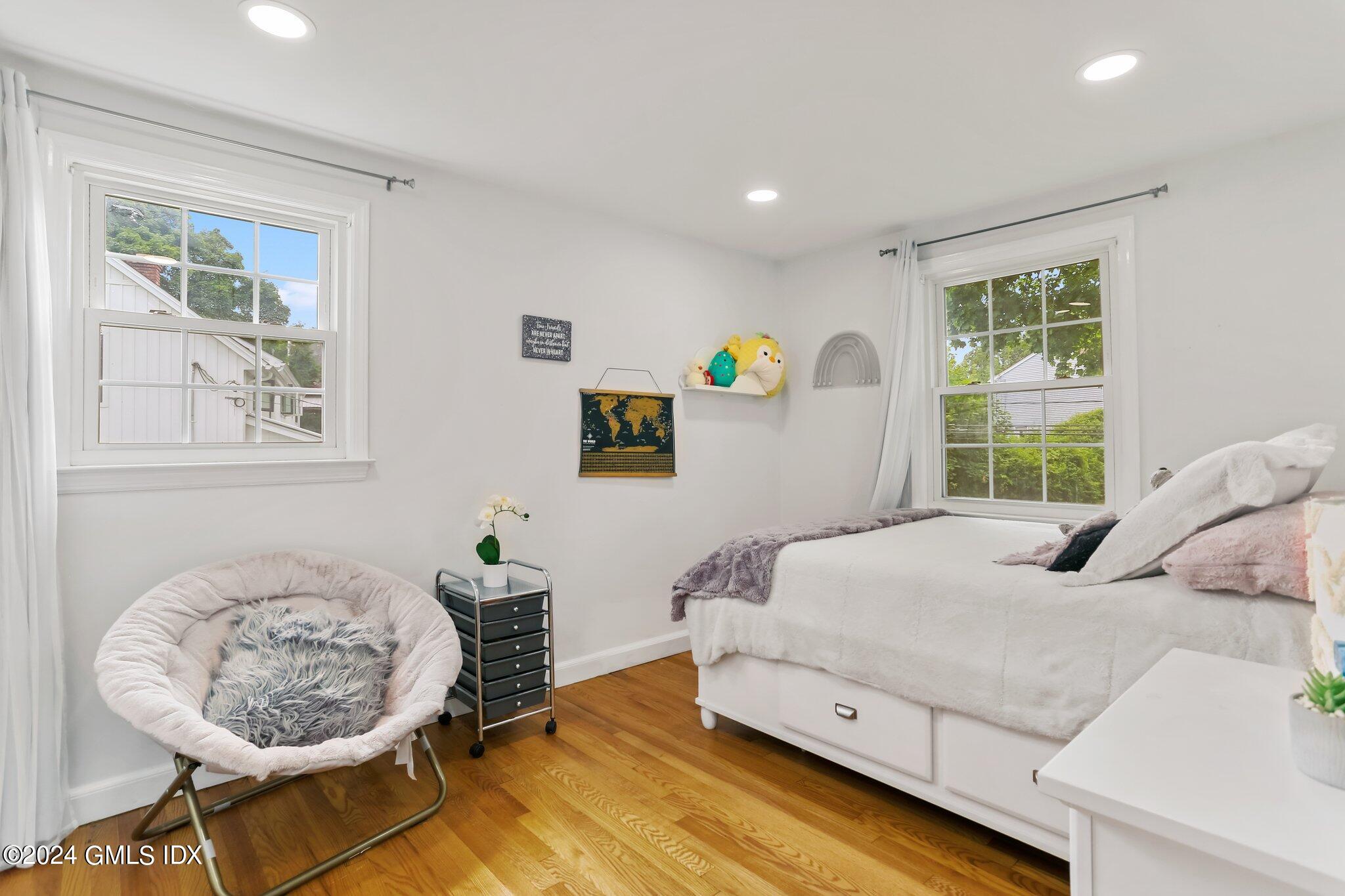 565 River Road Cos Cob, CT 06870 - Photo 15 of 29 a bedroom with a bed and a window