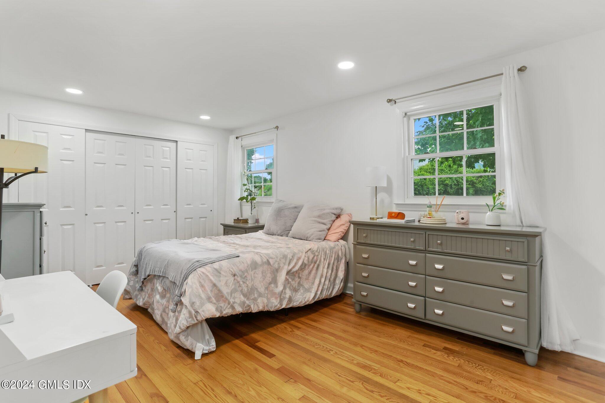 565 River Road Cos Cob, CT 06870 - Photo 18 of 29 a bedroom with a bed and a window