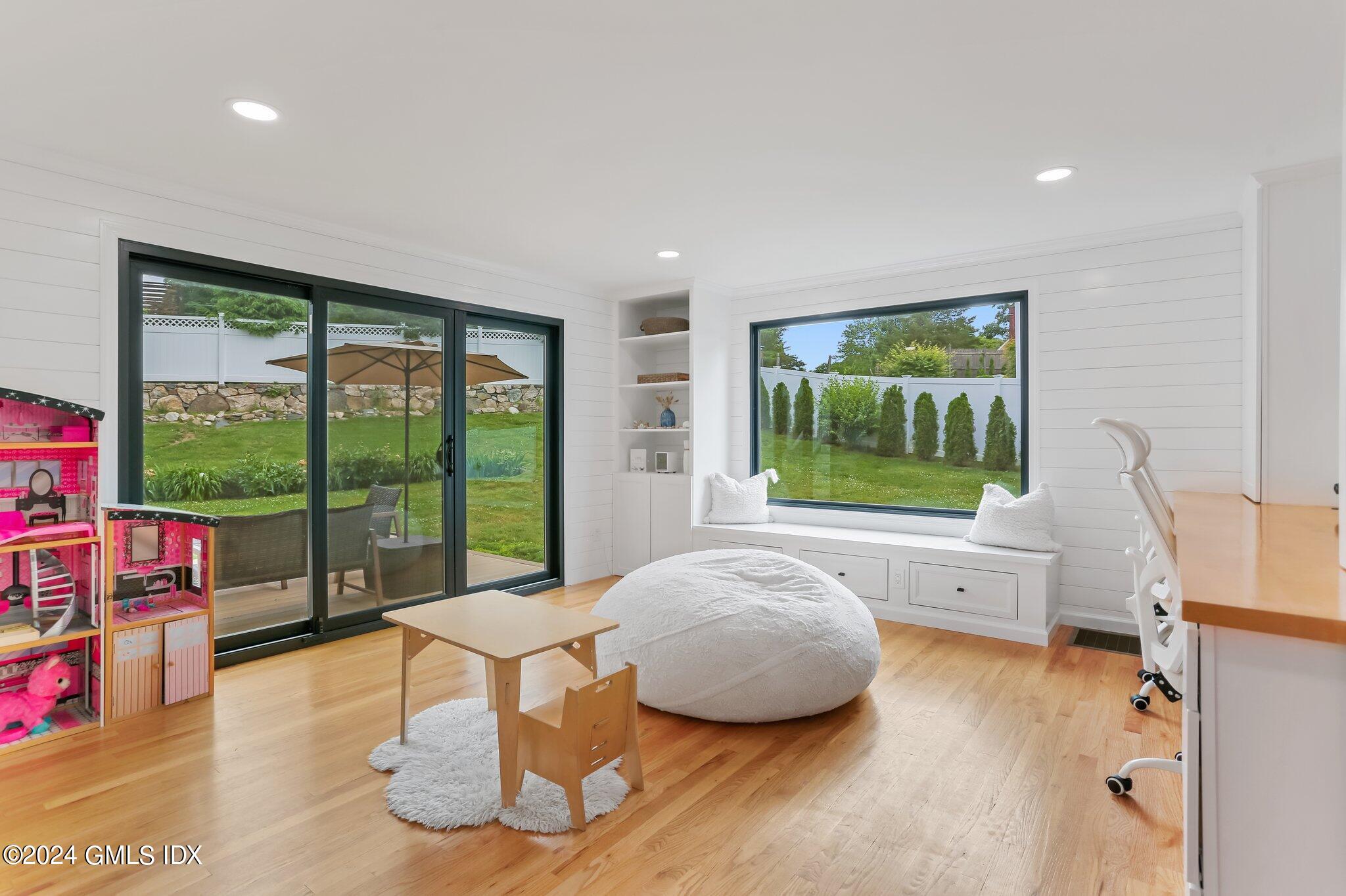 565 River Road Cos Cob, CT 06870 - Photo 19 of 29 a living room with furniture and a large window
