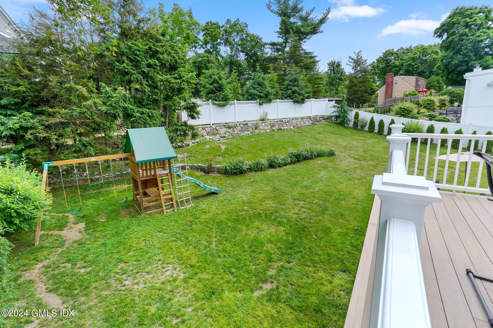 565 River Road Cos Cob, CT 06870 - Photo 27 of 29 a view of a chair and table on the garden