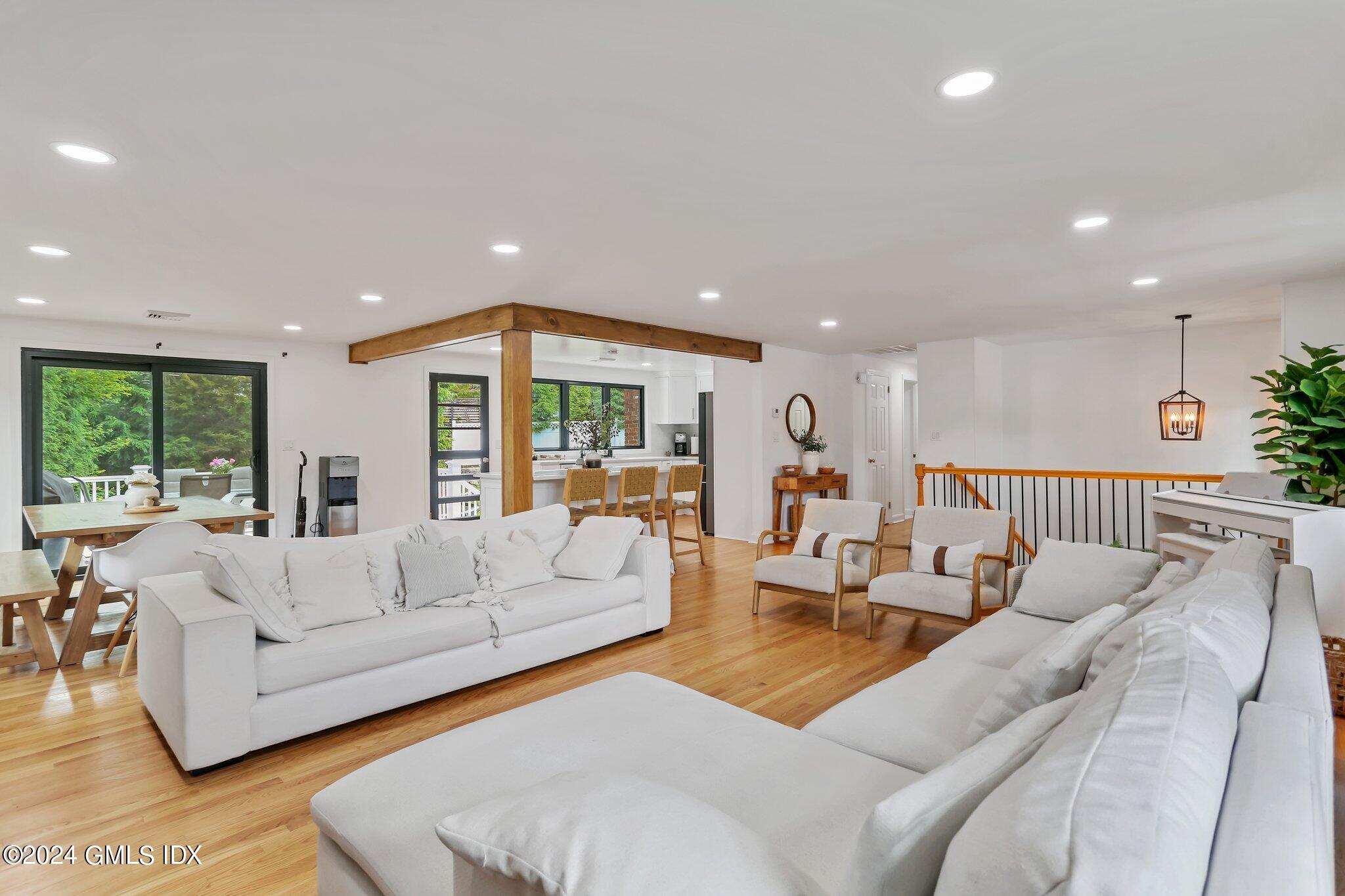 565 River Road Cos Cob, CT 06870 - Photo 5 of 29 a living room with furniture and a large window
