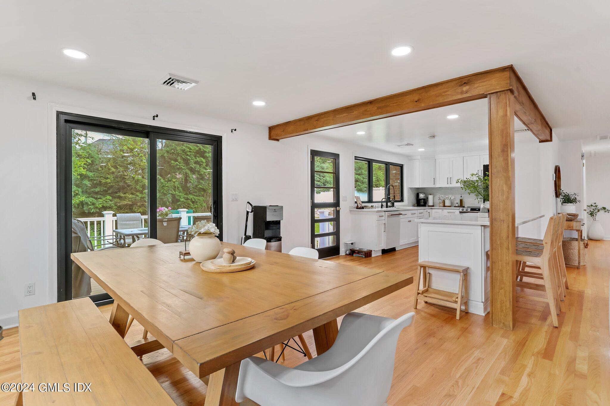 565 River Road Cos Cob, CT 06870 - Photo 7 of 29 a view of a dining room with furniture window and wooden floor