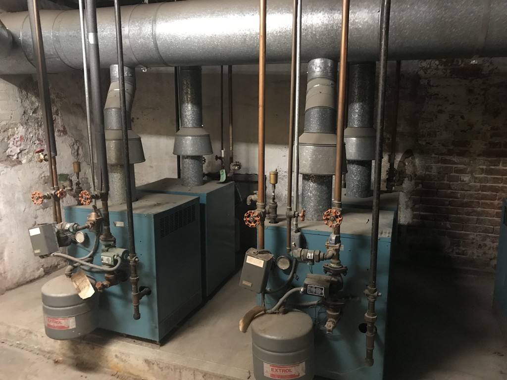 870 Pine Street Fall River, MA 02720 - Photo 11 of 19 a bathroom with a toilet a sink and mirror