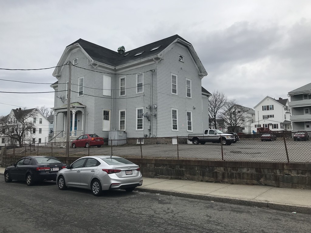 870 Pine Street Fall River, MA 02720 - Photo 2 of 19 a car parked in front of a house