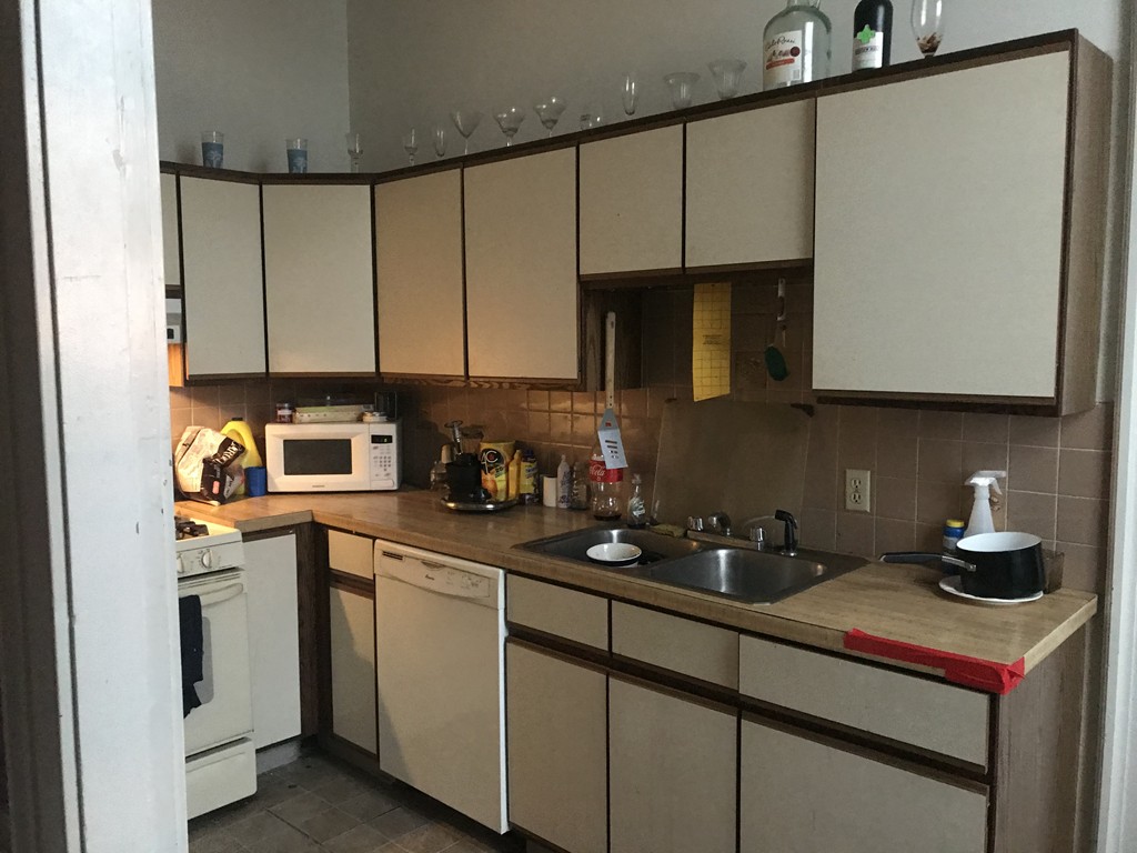 870 Pine Street Fall River, MA 02720 - Photo 7 of 19 a kitchen with stainless steel appliances granite countertop a sink a stove and a microwave