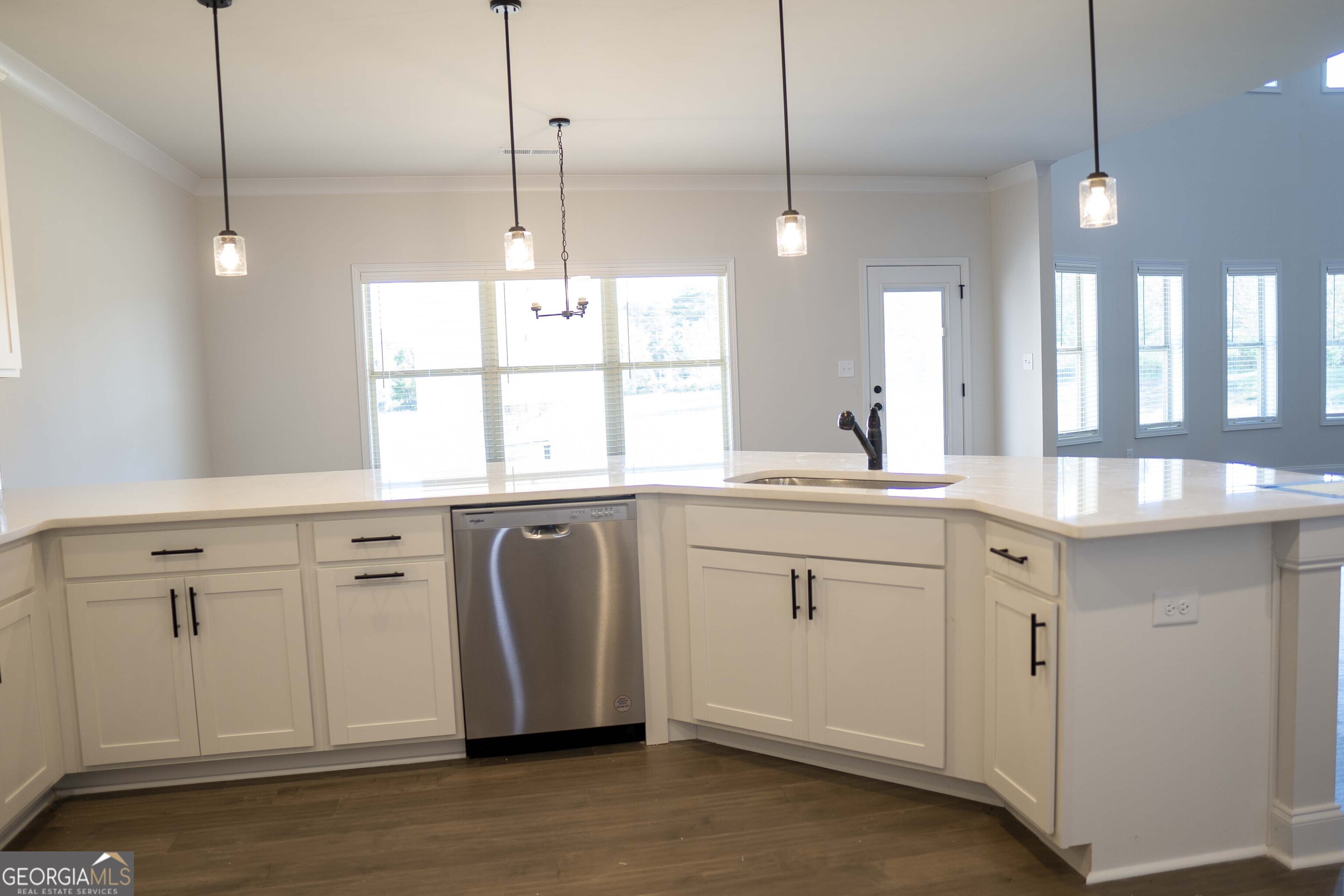 600 Beaver Court Perry, GA 31069 - Photo 19 of 48 a kitchen with white cabinets and window