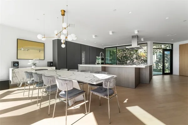 a kitchen with stainless steel appliances granite countertop a stove and a refrigerator