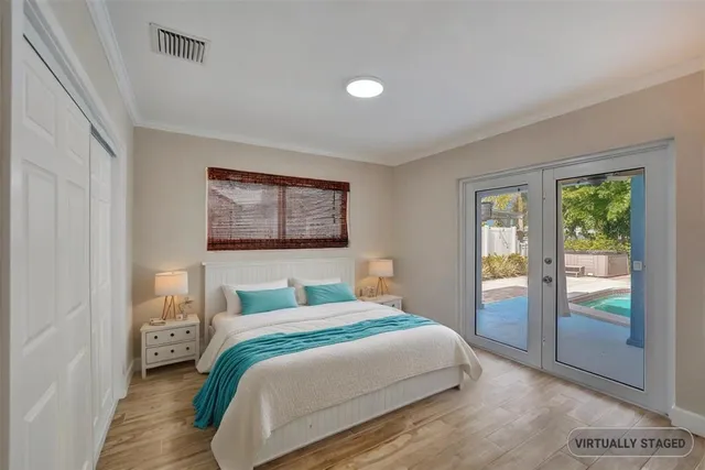 a bedroom with a large bed and a window