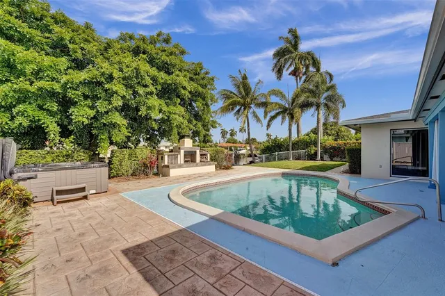 a view of a swimming pool with a patio