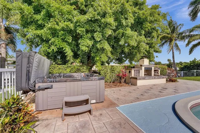 a view of a patio with couches and potted plants