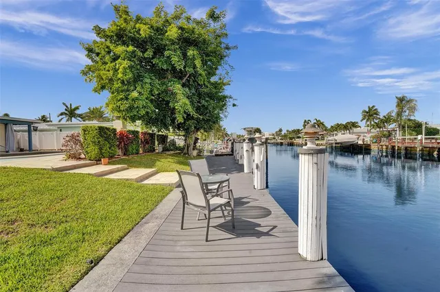 a view of a lake with outdoor seating space