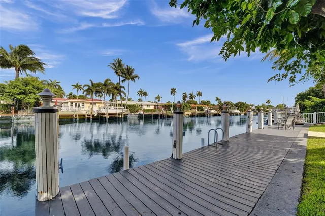a view of a lake with boats and trees in the background