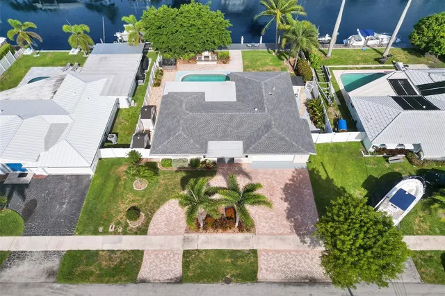 an aerial view of a house with a yard and garden