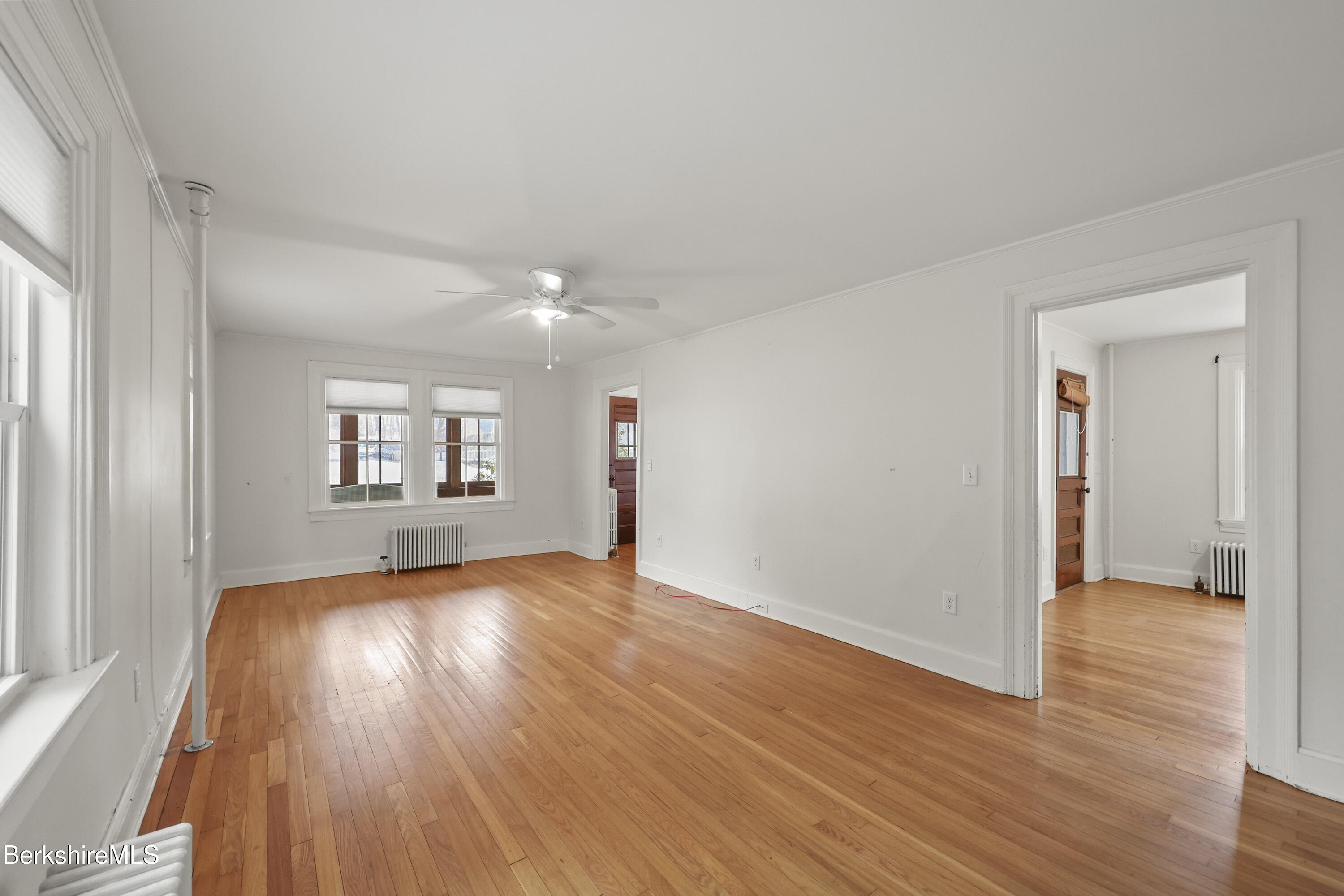 155 Laurel Street Lee, MA 01238 - Photo 12 of 43 wooden floor in an empty room with a window