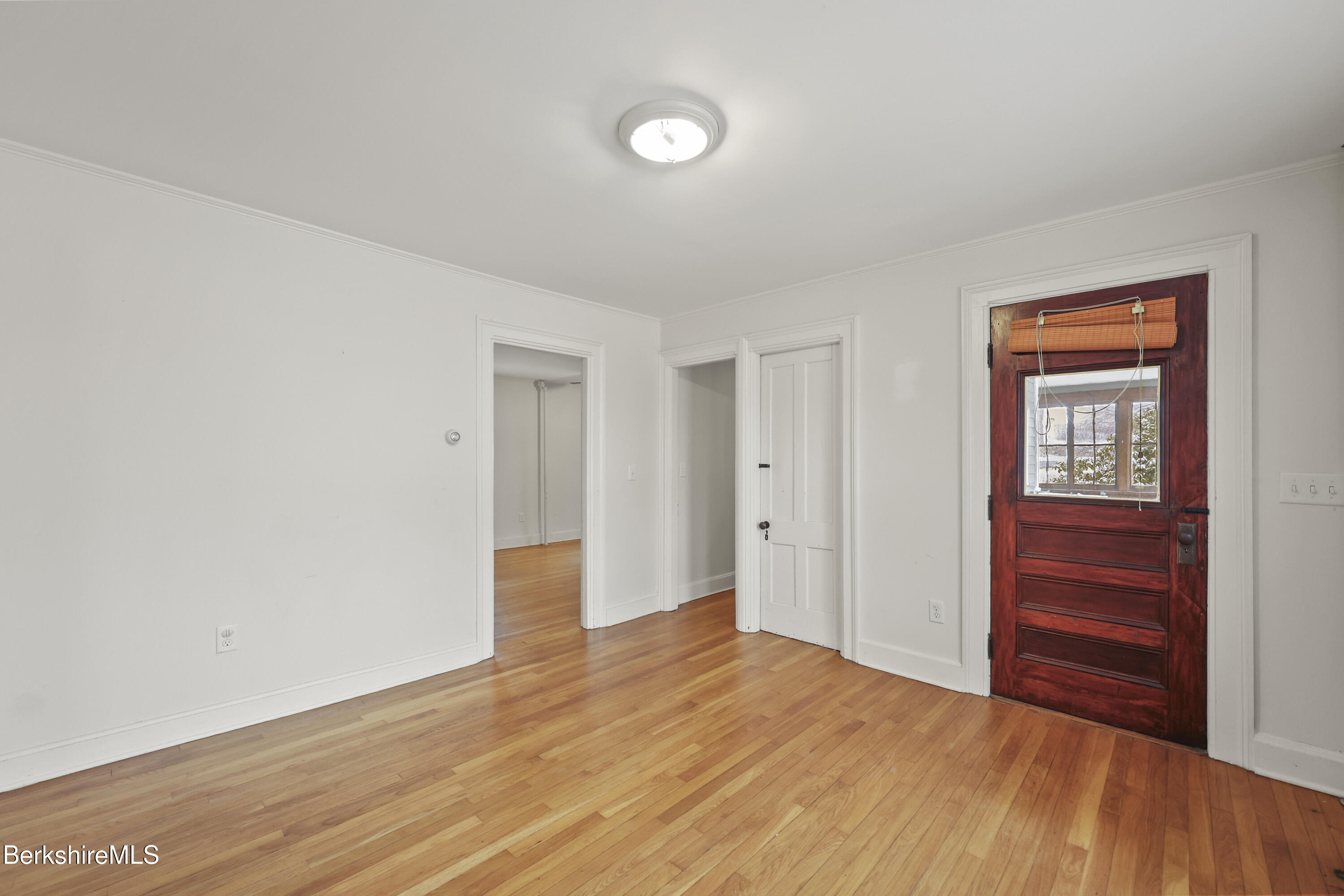 155 Laurel Street Lee, MA 01238 - Photo 16 of 43 a view of empty room with wooden floor and fan